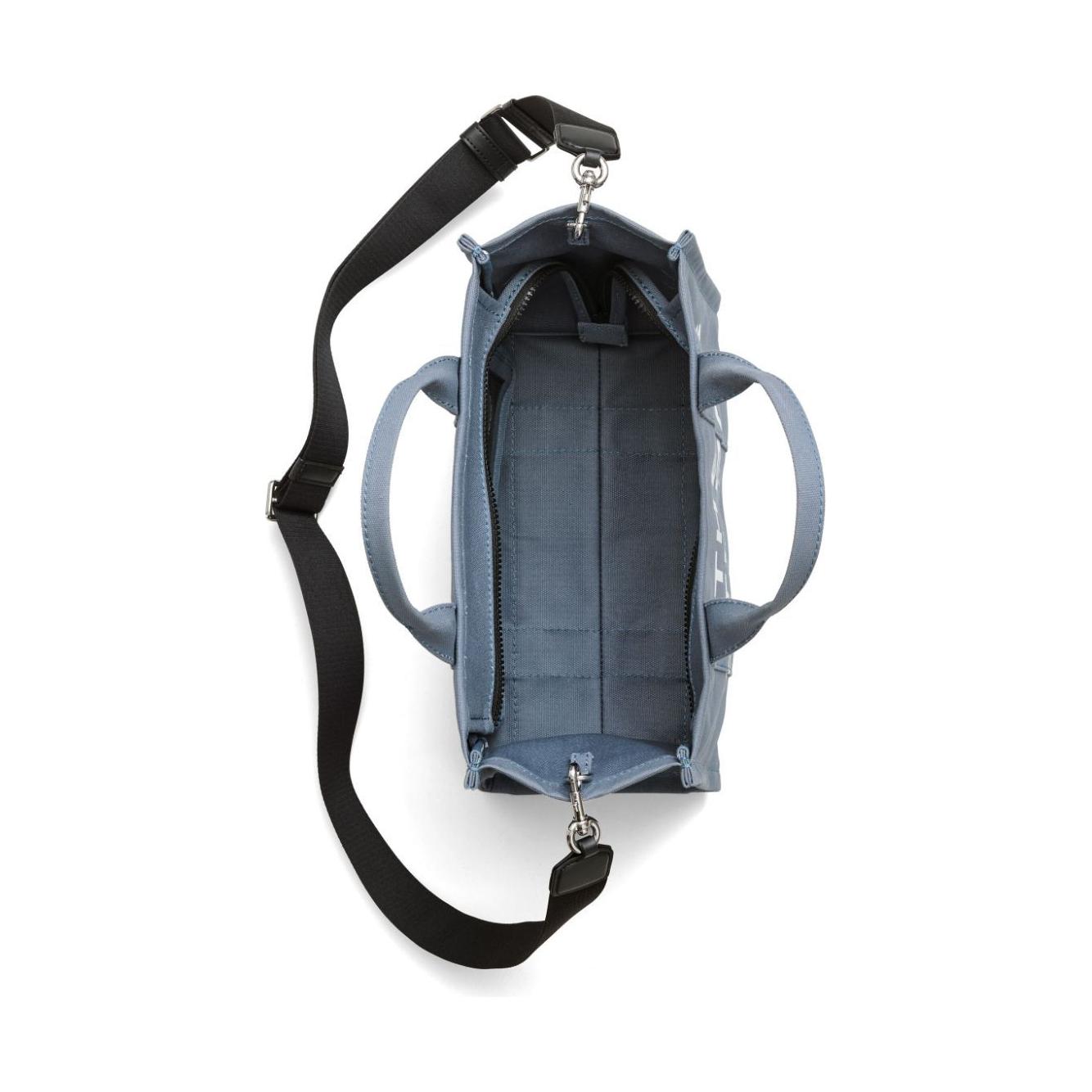 Front view with bag zipped and handles upright.