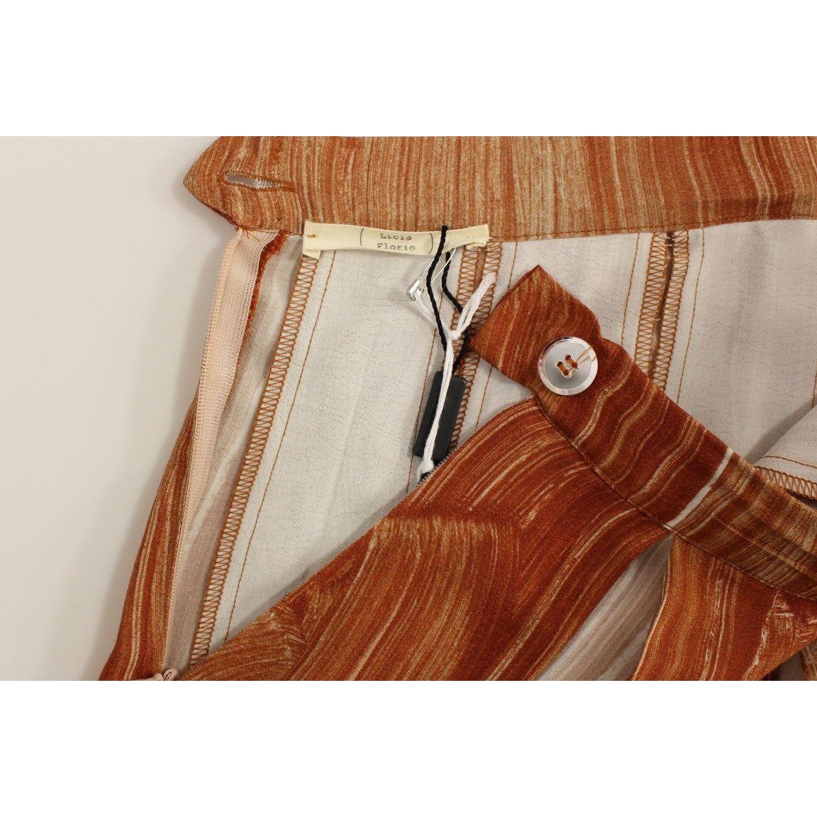 تنورة أنيقة باللون البرتقالي والبني من Licia Florio أسفل الركبة